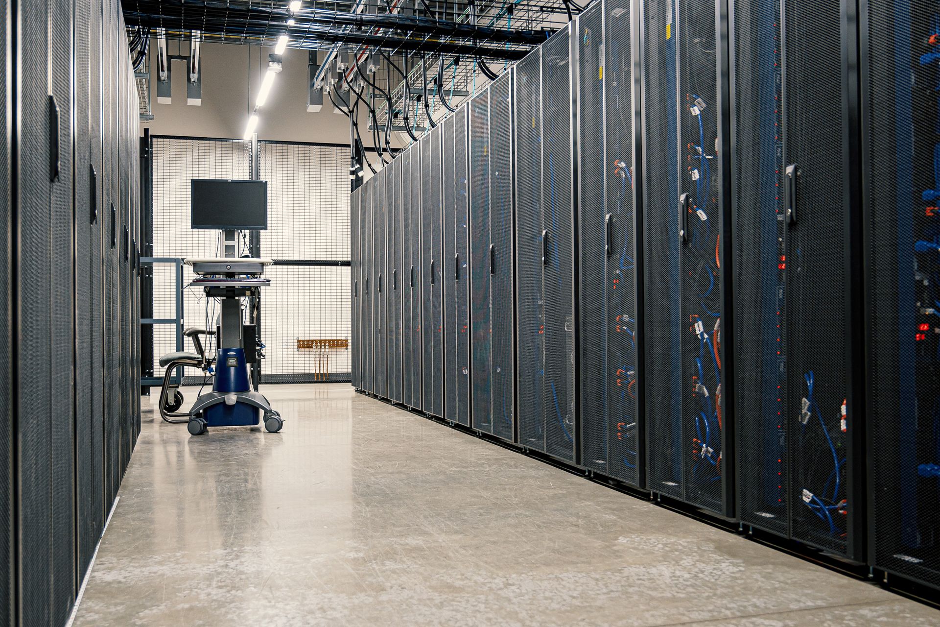 Data center aisle lined with tall server racks